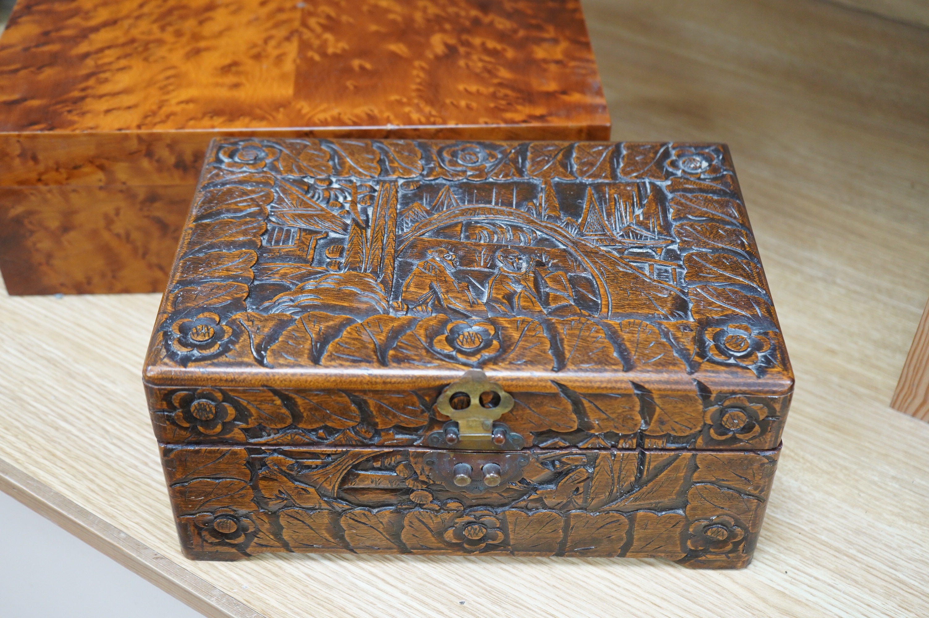 A burr walnut humidor and an Indonesian, possibly Javan, carved wood box, largest 39cm wide. Condition - fair to good